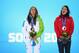 SOCHI, RUSSIA - FEBRUARY 12: (L-R) Joint gold medalists Tina Maze of Slovenia and Dominique Gisin of Switzerland celebrate during the medal ceremony for the for the Alpine Skiing Women's Downhill on day five of the Sochi 2014 Winter Olympics at Medals Plaza on February 12, 2014 in Sochi, Russia. (Photo by Paul Gilham/Getty Images)