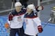 USA defenseman John Carlson, right, is congratulated for his goal against Slovakia by USA forward James van Riemsdyk during the 2014 Winter Olympics men's ice hockey game at Shayba Arena, Thursday, Feb. 13, 2014, in Sochi, Russia. (AP Photo/Matt Slocum)