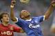 Schalke's new player Dennis Aogo, right, and Leverkusen's Giulio Donati of Italy challenge for the ball during the German soccer Bundesliga match between FC Schalke 04 and Bayer Leverkusen at the arena in Gelsenkirchen, Germany, Saturday, Aug. 31, 2013. (AP Photo/Martin Meissner)