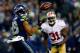 SEATTLE, WA - JANUARY 19: Wide receiver Doug Baldwin #89 of the Seattle Seahawks catches the ball as strong safety Donte Whitner #31 of the San Francisco 49ers defends during the 2014 NFC Championship at CenturyLink Field on January 19, 2014 in Seattle, Washington. (Photo by Tom Pennington/Getty Images)