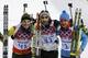 France's gold medal winner Martin Fourcade is flanked by Germany's silver medal winner Erik Lesser, left, and Russia's bronze medal winner Yevgeny Garanichev after the flower ceremony of the men's biathlon 20k individual race, at the 2014 Winter Olympics, Thursday, Feb. 13, 2014, in Krasnaya Polyana, Russia. (AP Photo/Kirsty Wigglesworth)