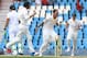 Australia's bowler Mitchell Johnson, second from right, with teammates reacts after dismissing South Africa's batsman Faf du Plessis, left, for 3 runs on the second day of their their cricket Test match at Centurion Park in Pretoria, South Africa, Thursday, Feb. 13, 2014. (AP Photo/ Themba Hadebe)