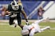 Michigan State's Jeremy Langford, left, is tackled by Ohio State's Bradley Roby (1) during the first half of a Big Ten Conference championship NCAA college football game Saturday, Dec. 7, 2013, in Indianapolis. (AP Photo/Darron Cummings)