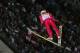 Poland's gold medal winner Kamil Stoch makes his second attempt during the men's normal hill ski jumping final at the 2014 Winter Olympics, Sunday, Feb. 9, 2014, in Krasnaya Polyana, Russia. (AP Photo/Dmitry Lovetsky)
