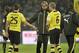 Dortmund head coach Juergen Klopp shakes hands with Sokratis, left, and Sven Bender, right, after the German Bundesliga soccer match between Borussia Dortmund and FC Augsburg in Dortmund, Germany, Saturday, Jan. 25, 2014. The match ended 2-2. (AP Photo/Martin Meissner)