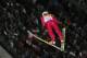 Poland's gold medal winner Kamil Stoch makes his second attempt during the men's normal hill ski jumping final at the 2014 Winter Olympics, Sunday, Feb. 9, 2014, in Krasnaya Polyana, Russia. (AP Photo/Dmitry Lovetsky)