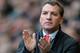 LIVERPOOL, ENGLAND - FEBRUARY 08: Liverpool Manager Brendan Rodgers applauds during the Barclays Premier League match between Liverpool and Arsenal at Anfield on February 8, 2014 in Liverpool, England. (Photo by Michael Regan/Getty Images)