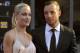 This Nov. 4, 2012 photo shows Oscar Pistorius and girlfriend Reeva Steenkamp at an awards ceremony in Johannesburg, South Africa. A lawyer for the family of Oscar Pistorius' slain girlfriend said Tuesday Aug. 20 2013, that representatives of the two families were in contact, possibly over an out-of-court settlement that would compensate Steenkamp's parents for her killing by the double-amputee Olympian, Pistorius. (AP Photo/City Press, Lucky Nxumalo) SOUTH AFRICA OUT