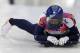 Elizabeth Yarnold of Great Britain brakes in the finish area after her first run during the women's skeleton competition at the 2014 Winter Olympics, Thursday, Feb. 13, 2014, in Krasnaya Polyana, Russia. (AP Photo/Natacha Pisarenko)