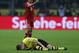 Dortmund's Marco Reus lies injured on the pitch as Bayern's Rafinha, rear, points during the German first division Bundesliga soccer match between BvB Borussia Dortmund and Bayern Munich in Dortmund, Germany, Saturday, Nov. 23, 2013. (AP Photo/Frank Augstein)
