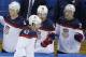 USA forward David Backes celerates his goal against Slovakia with his teammates on the bench during the 2014 Winter Olympics men's ice hockey game at Shayba Arena, Thursday, Feb. 13, 2014, in Sochi, Russia. (AP Photo/Matt Slocum)