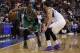 Boston Celtics' Rajon Rondo, left, in action against Philadelphia 76ers' Michael Carter-Williams, right, during the second half of an NBA basketball game, Wednesday, Feb. 5, 2014, in Philadelphia. The Celtics won 114-108. (AP Photo/Chris Szagola)