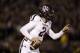 Texas A&M quarterback Johnny Manziel scrambles during the first half of an NCAA college football game against Missouri on Saturday, Nov. 30, 2013, in Columbia, Mo. (AP Photo/Jeff Roberson)