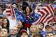 US fans cheer a second period goal by the USA against Russia during a men's ice hockey game at the 2014 Winter Olympics, Saturday, Feb. 15, 2014, in Sochi, Russia. (AP Photo/Mark Humphrey)