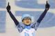 Victor An of Russia celebrates winning in a men's 1000m short track speedskating final at the Iceberg Skating Palace during the 2014 Winter Olympics, Saturday, Feb. 15, 2014, in Sochi, Russia. (AP Photo/Vadim Ghirda)