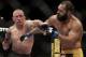 Johny Hendricks, right, exchanges punches with Georges St. Pierre, of Canada, during a UFC 167 mixed martial arts championship welterweight bout on Saturday, Nov. 16, 2013, in Las Vegas. St. Pierre won by split decision. (AP Photo/Isaac Brekken)