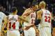 Feb 11, 2014; Chicago, IL, USA; Chicago Bulls point guard D.J. Augustin (14), Chicago Bulls center Joakim Noah (13) and Chicago Bulls power forward Taj Gibson (22) celebrate scoring in the second half against the Atlanta Hawks at the United Center. The Bulls beat the Hawks 100-85. Mandatory Credit: Matt Marton-USA TODAY Sports