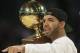 Rapper Drake walks on the court during the skills competition at the NBA All Star basketball game, Saturday, Feb. 15, 2014, in New Orleans. (AP Photo/Gerald Herbert)