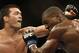 Lyoto Machida, from Brazil, left, and Phil Davis, from the U.S., battle during their UFC 163 mixed martial arts Light Heavyweight bout in Rio de Janeiro, Brazil, Sunday, Aug. 4, 2013. (AP Photo/Felipe Dana)