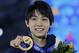 Men's free skate figure skating gold medalist Yuzuru Hanyu of Japan pose with his medal during the medals ceremony at the 2014 Winter Olympics, Saturday, Feb. 15, 2014, in Sochi, Russia. (AP Photo/David J. Phillip )