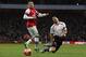 Liverpool's Luis Suarez, right, is tackled by Arsenal's Alex Oxlade-Chamberlain during their English FA Cup fifth round soccer match at Emirates Stadium in London, Sunday, Feb. 16, 2014. (AP Photo/Sang Tan)