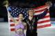 Meryl Davis and Charlie White of the United States pose for photographers after placing first in the ice dance free dance figure skating finals at the Iceberg Skating Palace during the 2014 Winter Olympics, Monday, Feb. 17, 2014, in Sochi, Russia. (AP Photo/Vadim Ghirda)