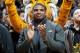 Missouri's All-American defensive end Michael Sam claps during the Cotton Bowl trophy presentation at halftime of an NCAA college basketball game between Missouri and Tennessee, Saturday, Feb. 15, 2014, in Columbia, Mo. Sam came out to the entire country Sunday, Feb. 9, and could become the first openly gay player in the NFL. (AP Photo/L.G. Patterson)