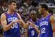 Philadelphia 76ers' Spencer Hawes, left, talks with Evan Turner, left, during the second half of an NBA basketball game, Saturday, Jan. 25, 2014, in Philadelphia. The Thunder won 103-91. (AP Photo/Chris Szagola)