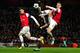 LONDON, ENGLAND - FEBRUARY 19: Laurent Koscielny of Arsenal clears the ball in front of Mario Mandzukic of Bayern Muenchen and his team-mate Thomas Vermaelen during the UEFA Champions League round of 16 first leg match between Arsenal and Bayern Muenchen at Emirates Stadium on February 19, 2013 in London, England. (Photo by Shaun Botterill/Getty Images)
