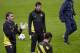 Barcelona's Lionel Messi, centre, trains with teammates at Manchester City's Etihad Stadium, Manchester, England, Monday Feb. 17, 2014. Barcelona will play Manchester City on Tuesday in a Champions League first knock out round soccer match. (AP Photo/Jon Super)