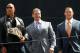 This image released by Starpix shows actor and WWE star Dwayne Johnson, better known as The Rock, left, with Vince McMahon, and WWE star John Cena at a news conference at Radio City Music Hall in New York on Thursday, April 4, 2013. Johnson and Cena will face off in the ring at Wrestlemania 29 on Sunday, April 7, at at MetLife Stadium in East Rutherford, N.J. (AP Photo/Starpix, Dave Allocca)