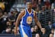 Golden State Warriors forward Harrison Barnes takes court against the Denver Nuggets in the first quarter of an NBA basketball game in Denver on Monday, Dec. 23, 2013. (AP Photo/David Zalubowski)