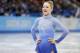 Gracie Gold of the United States leaves the ice after competing in the women's team free skate figure skating competition at the Iceberg Skating Palace during the 2014 Winter Olympics, Sunday, Feb. 9, 2014, in Sochi, Russia. (AP Photo/Darron Cummings, Pool)