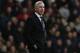 Newcastle United's manager Alan Pardew calls out to his players as he watches his team play against West Ham United, during their English Premier League soccer match at Upton Park, London, Saturday, Jan. 18, 2014. (AP Photo/Sang Tan)
