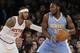 New York Knicks' Carmelo Anthony (7) defends Denver Nuggets' Kenneth Faried (35) during the first half of an NBA basketball game Friday, Feb. 7, 2014, in New York. (AP Photo/Frank Franklin II)