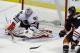 Chicago Blackhawks goalie Corey Crawford (50) defends the goal as Anaheim Ducks center Andrew Cogliano (7) attacks in the first period of an NHL hockey game in Anaheim, Calif., Wednesday, Feb. 5, 2014. The Blackhawks won, 2-0. (AP Photo/Reed Saxon)