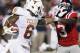 Texas cornerback Quandre Diggs (6) fights off Mississippi running back Jeff Scott (3) as he runs upfield with a 11-yard interception during the second quarter of an NCAA college football game in Oxford, Miss., Saturday, Sept. 15, 2012. (AP Photo/Rogelio V. Solis)