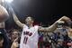 SMU guard Nic Moore celebrates with fans on the court after an NCAA college basketball game against Cincinnati on Saturday, Feb. 8, 2014, in Dallas. SMU won 76-55. (AP Photo/LM Otero)