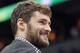 Minnesota Timberwolves forward Kevin Love smiles as he did not play in the game against the Portland Trail Blazers on Saturday, February 8, 2014 in Minneapolis.(AP Photo/Andy Clayton-King)