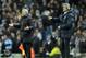 Manchester City's manager Manuel Pellegrini, right, and Chelsea's manager Jose Mourinho during their English Premier League soccer match at the Etihad stadium in Manchester, England, Monday Feb. 3, 2014. (AP Photo/Clint Hughes)