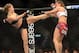Dec 28, 2013; Las Vegas, NV, USA; Ronda Rousey (red gloves) and Miesha Tate (blue gloves) during their UFC Women's Bantamweight Championship Bout at the MGM Grand Garden Arena. Ronda Rousey won Mandatory Credit: Jayne Kamin-Oncea-USA TODAY Sports