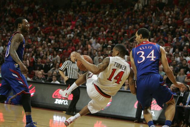 No. 8 Kansas hangs on to beat Texas Tech 64-63