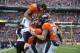 Denver Broncos wide receiver Eric Decker (87) leaps up to celebrate with tight end Joel Dreessen (81), wide receiver Demaryius Thomas (88) and running back Knowshon Moreno (27) after Moreno caught a pass for a touchdown agains the Baltimore Ravens in the second quarter of an AFC divisional playoff NFL football game, Saturday, Jan. 12, 2013, in Denver. (AP Photo/Jack Dempsey)