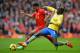 LIVERPOOL, ENGLAND - FEBRUARY 08: Raheem Sterling of Liverpool is challenged by Bacary Sagna of Arsenal during the Barclays Premier League match between Liverpool and Arsenal at Anfield on February 8, 2014 in Liverpool, England. (Photo by Michael Regan/Getty Images)