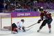 Latvia forward Lauris Darzins flips the puck past Canada goaltender Carey Price for a goal during the first period of a men's quarterfinal ice hockey game at the 2014 Winter Olympics, Wednesday, Feb. 19, 2014, in Sochi, Russia. (AP Photo/Julio Cortez)