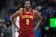 Cleveland Cavaliers forward Luol Deng, of Sudan, checks scoreboard while facing the Denver Nuggets in the third quarter of the Cavaliers' 117-109 victory in an NBA basketball game in Denver on Friday, Jan. 17, 2014. (AP Photo/David Zalubowski)