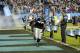 Carolina Panthers defensive end Greg Hardy (76) runs onto the field prior to an NFL football game against the New England Patriots in Charlotte, NC, Monday, Nov. 18, 2013. (AP Photo/Mike McCarn)