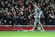 Arsenal's goalkeeper Wojciech Szczesny leaves the pitch after a red card during a Champions League, round of 16, first leg soccer match between Arsenal and Bayern Munich at the Emirates stadium in London, Wednesday, Feb. 19, 2014 .(AP Photo/Alastair Grant)