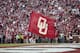NORMAN, OK - NOVEMBER 16: A member of the Oklahoma Sooners spirit squad waves a flag after a touchdown against the Iowa State Cyclones November 16, 2013 at Gaylord Family-Oklahoma Memorial Stadium in Norman, Oklahoma. Oklahoma defeated Iowa State 48-10. (Photo by Brett Deering/Getty Images)