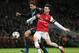Arsenal's Laurent Koscielny, right, and Bayern's Claudio Pizarro challenge for the ball during a Champions League, round of 16, first leg soccer match between Arsenal and Bayern Munich at the Emirates stadium in London, Wednesday, Feb. 19, 2014 .(AP Photo/Alastair Grant)